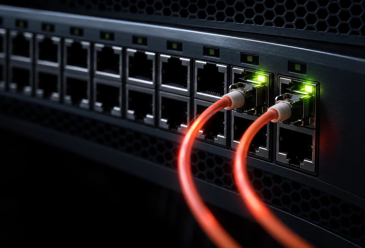 A dense cluster of glowing network ports on a dark switch, most of them dark and empty, two lit with green link lights, fibre strands curving away into black.